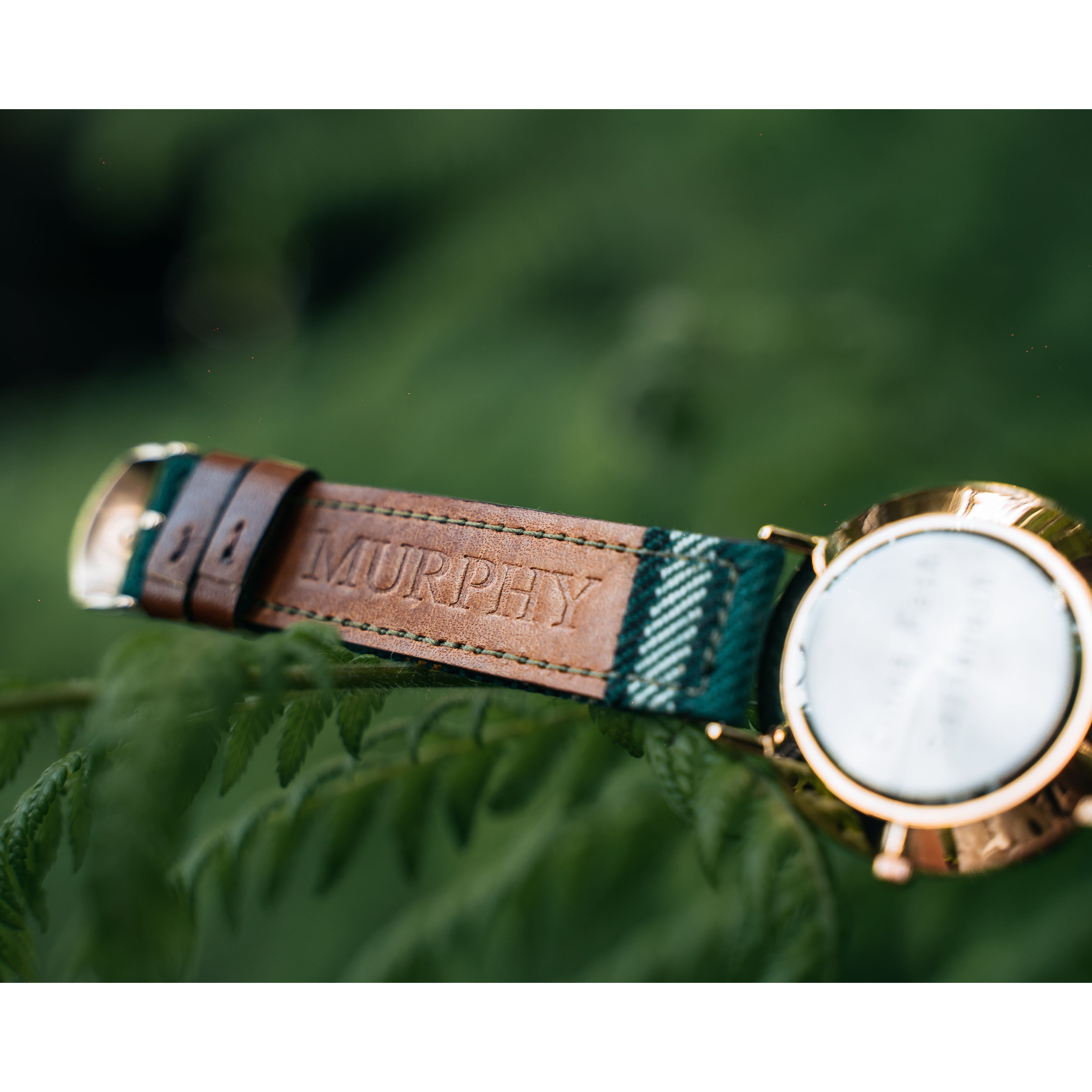 custom engraving that says "Murphy" on a custom tartan watch