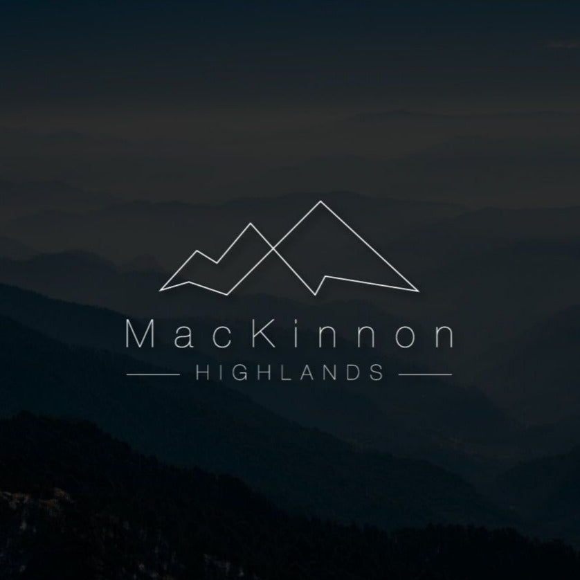 A gift card with a mountain range background, featuring the MacKinnon Highlands logo.