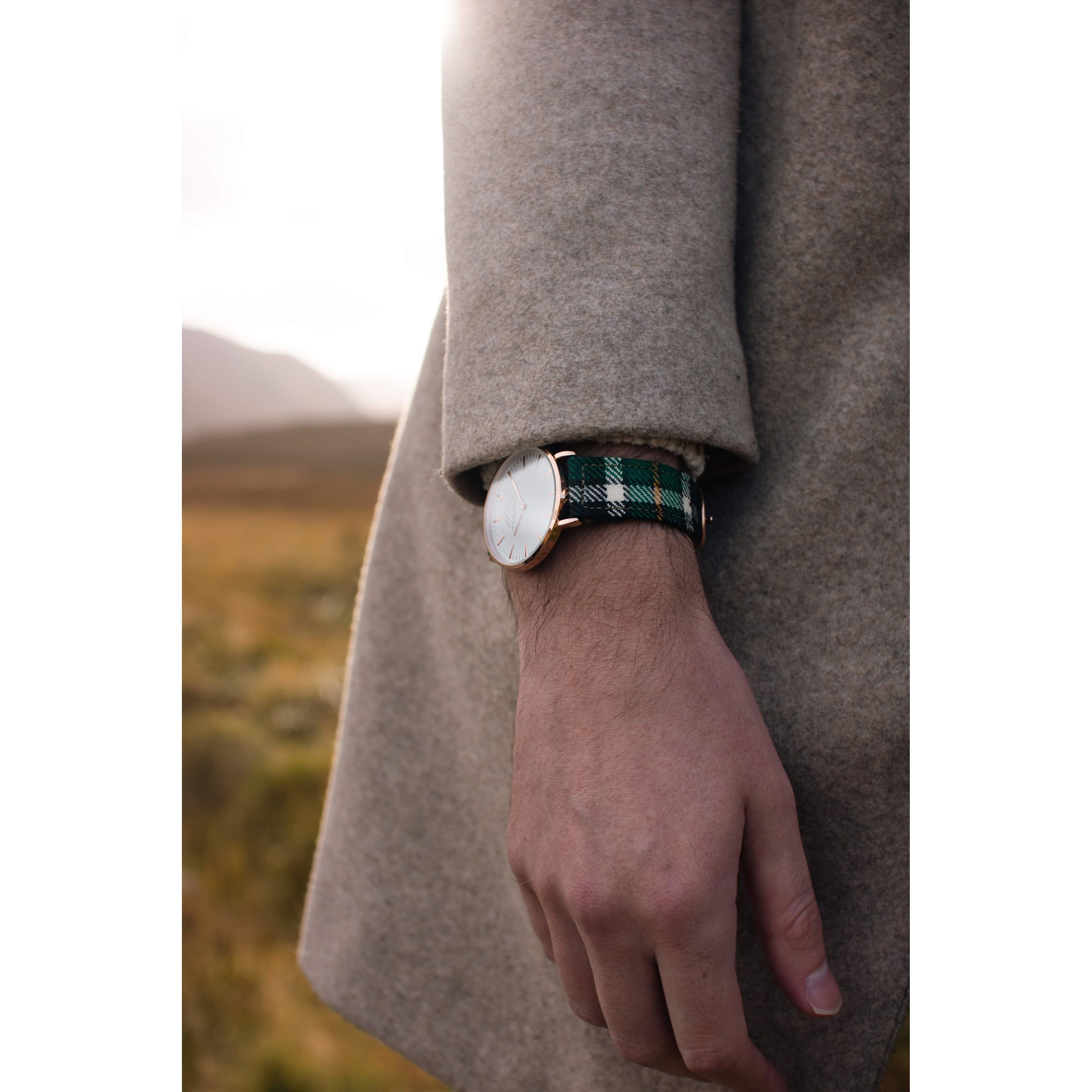 custom tartan watch on a mans hand with green tartan